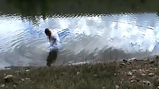 big wedding gown in a lake
