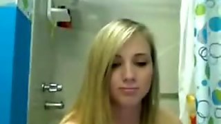 Blonde revealing her assets in shower - TopRealCams.com